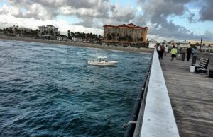 DEERFIELD BEACH FISHERMAN SPOTS BODY IN OCEAN BY PIER