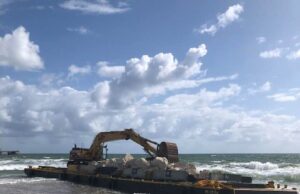 DEERFIELD BEACH STILL WITH BARGE ON BEACH