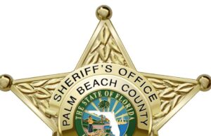 PBSO DEPUTY PINNED BETWEEN CARS