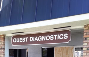 ELECTRIC WHEELCHAIR AND DRIVER PLOW THROUGH PLATE GLASS WINDOW AT QUEST LABS:RAISING HANDICAP ACCESS ISSUE TO PLAZA